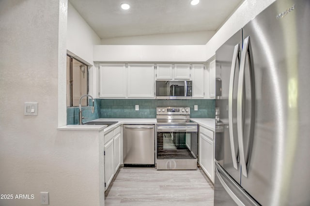 7300 N Dreamy Draw Dr Unit 202, Phoenix, AZ 85020 - kitchen with stainless steel appliances, tasteful backsplash, light wood-style floors, light countertops, and recessed lighting