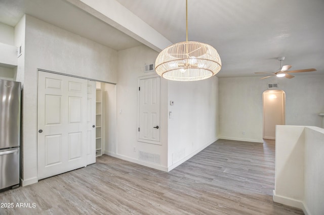 7300 N Dreamy Draw Dr Unit 202, Phoenix, AZ 85020 - unfurnished dining area with wood finished floors, a ceiling fan, arched walkways, and a chandelier