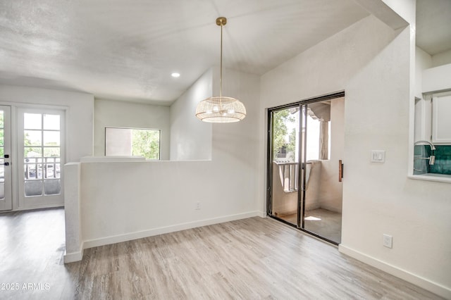 7300 N Dreamy Draw Dr Unit 202, Phoenix, AZ 85020 - unfurnished dining area featuring wood finished floors, a chandelier, and recessed lighting