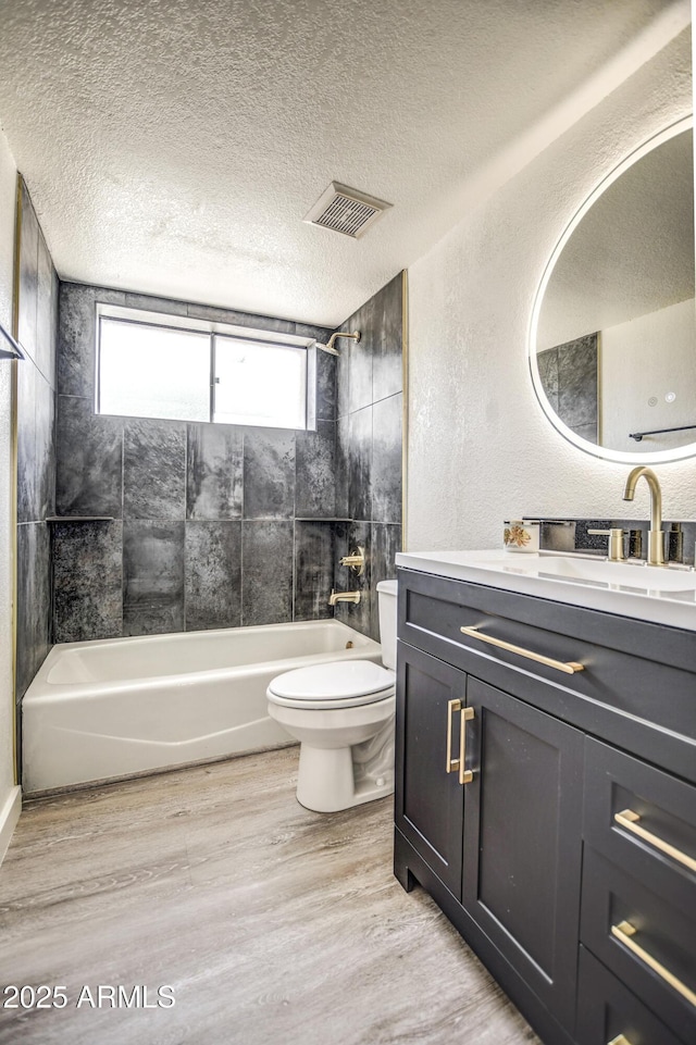 7300 N Dreamy Draw Dr Unit 202, Phoenix, AZ 85020 - full bath featuring vanity, shower / bathtub combination, wood finished floors, and a textured ceiling