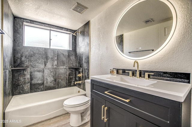 7300 N Dreamy Draw Dr Unit 202, Phoenix, AZ 85020 - bathroom with a textured wall, vanity, bathtub / shower combination, a textured ceiling, and wood finished floors