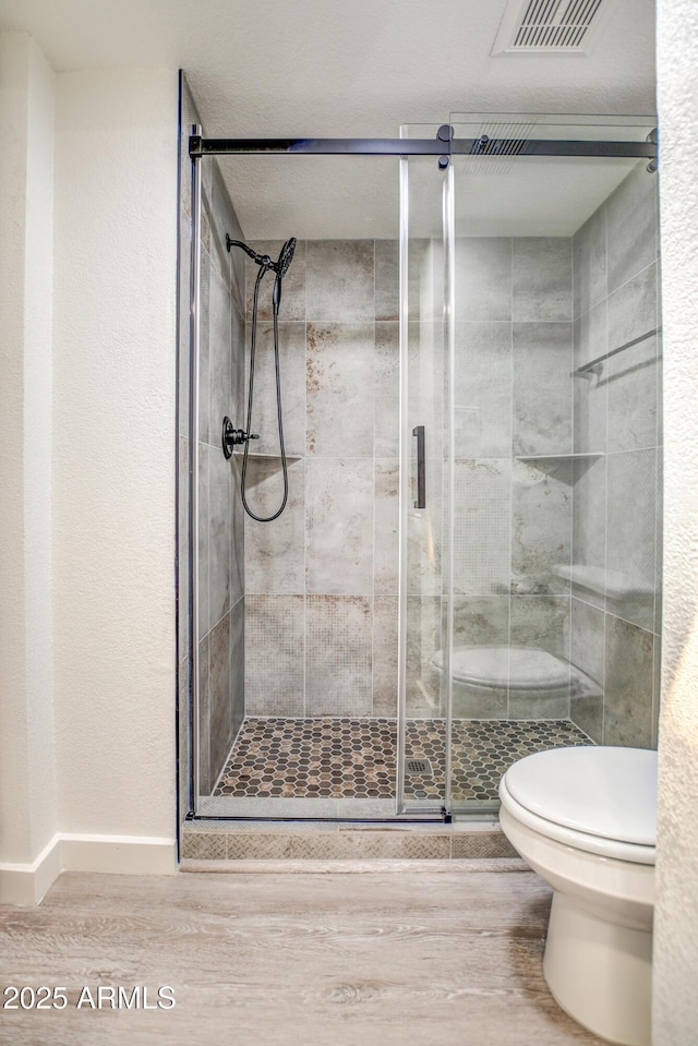 7300 N Dreamy Draw Dr Unit 202, Phoenix, AZ 85020 - full bath featuring wood finished floors and a shower stall