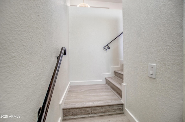 7300 N Dreamy Draw Dr Unit 202, Phoenix, AZ 85020 - staircase featuring wood finished floors and a textured wall