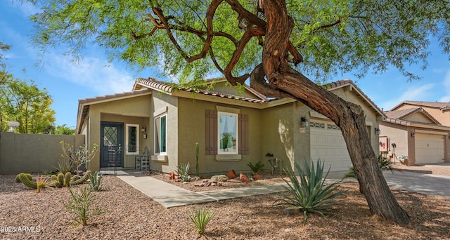 4073 E Stable Ct, Gilbert, AZ 85297 - view of front of property with an attached garage, stucco siding, a tile roof, and concrete driveway