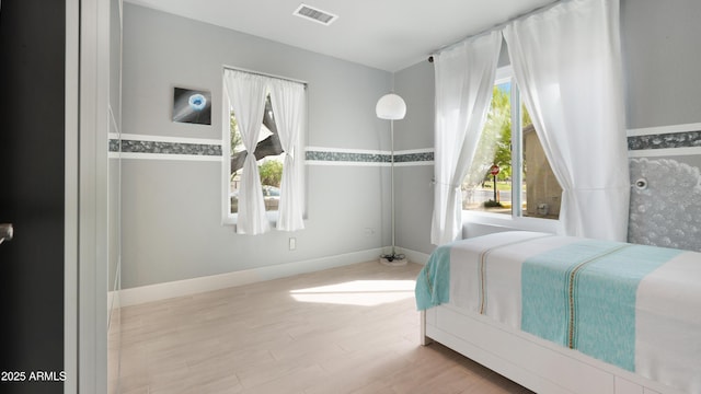 4073 E Stable Ct, Gilbert, AZ 85297 - bedroom featuring wood finished floors and baseboards