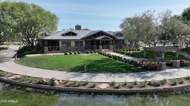 4073 E Stable Ct, Gilbert, AZ 85297 - rear view of house with stone siding, a pergola, a lawn, a chimney, and a water view