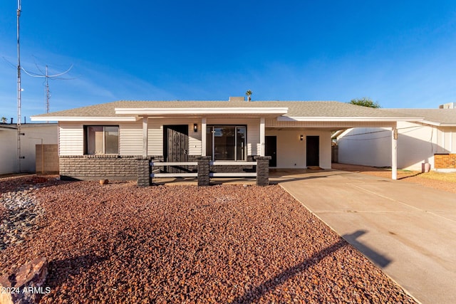 ranch-style home with a carport