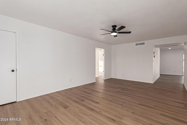 spare room featuring hardwood / wood-style flooring and ceiling fan