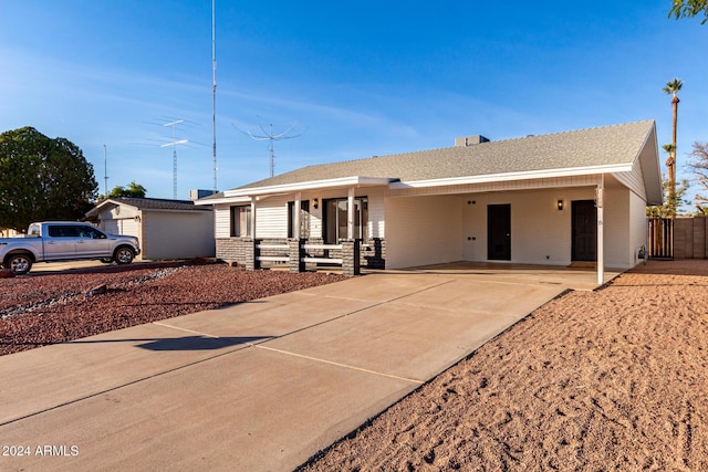 single story home featuring a carport