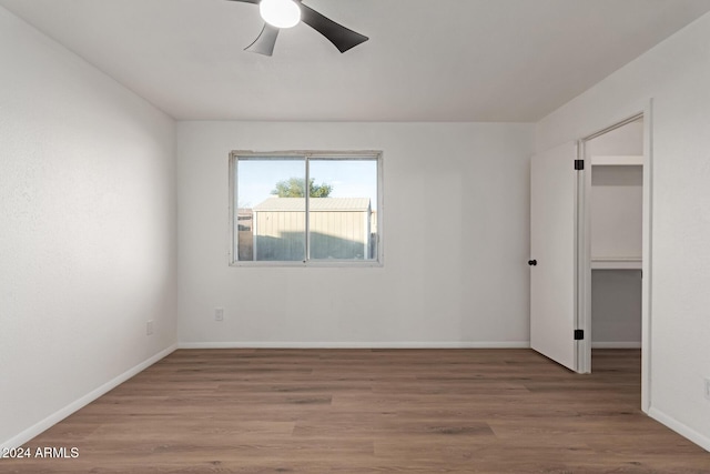 unfurnished room featuring ceiling fan and wood-type flooring