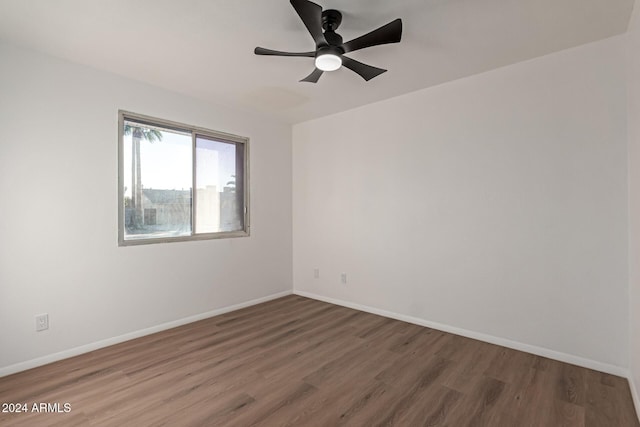 empty room with ceiling fan and wood-type flooring