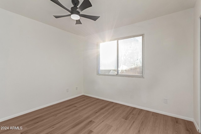 unfurnished room with ceiling fan and light hardwood / wood-style floors