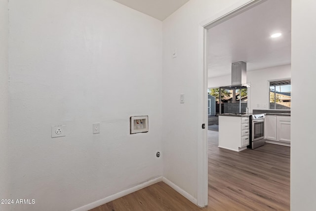 clothes washing area with hookup for an electric dryer, hookup for a washing machine, and dark hardwood / wood-style flooring