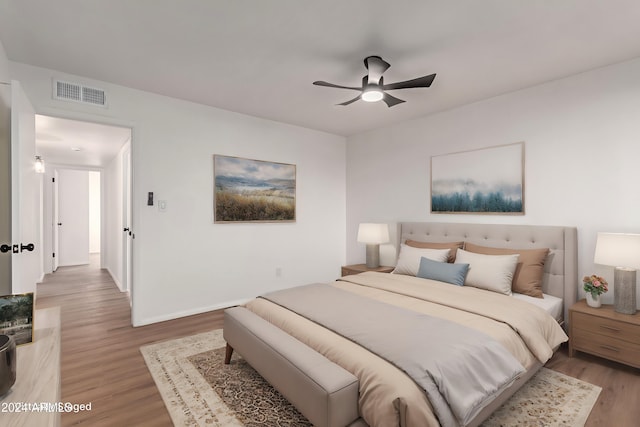 bedroom featuring hardwood / wood-style flooring and ceiling fan