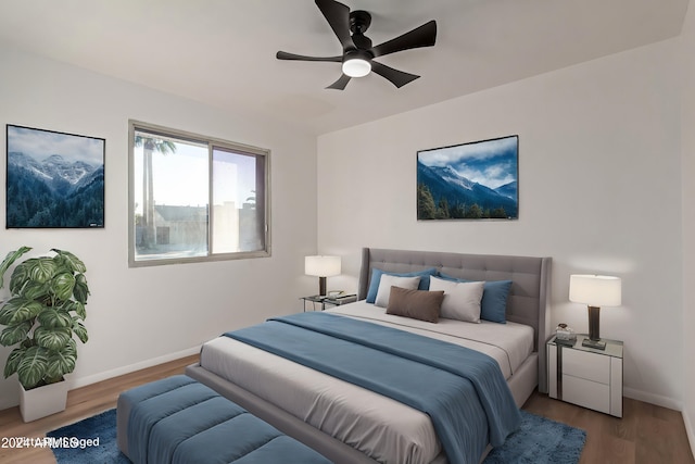 bedroom with hardwood / wood-style flooring and ceiling fan