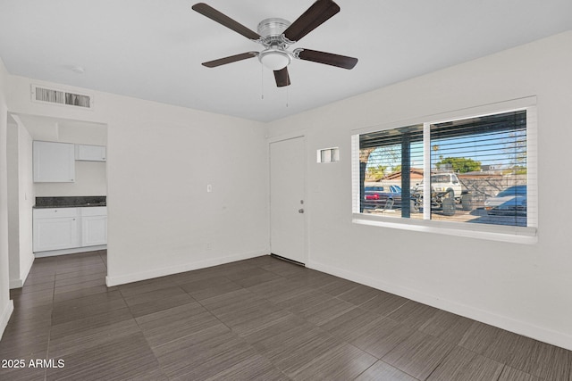 unfurnished room featuring ceiling fan