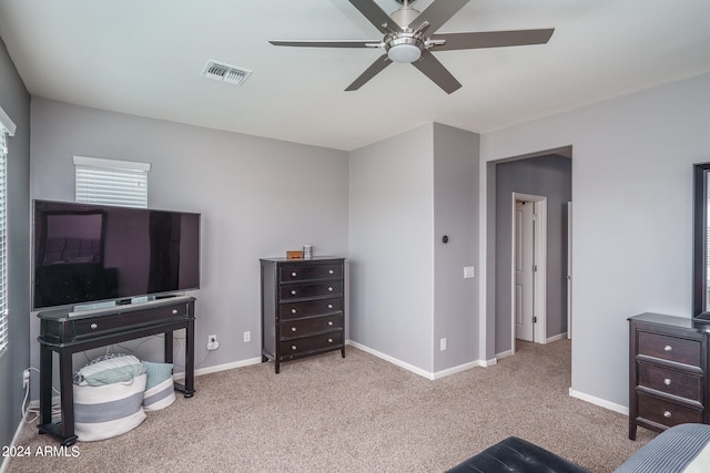 bedroom with light carpet and ceiling fan