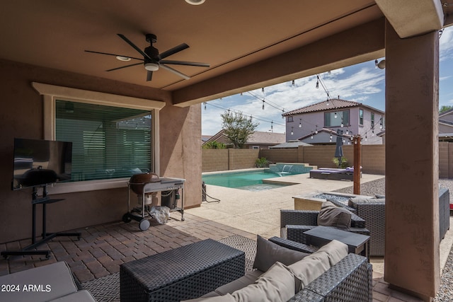 view of patio / terrace with area for grilling, ceiling fan, a fenced in pool, and outdoor lounge area