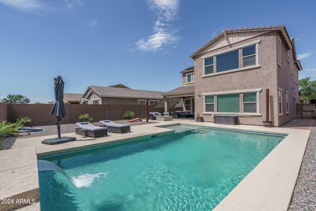 view of pool featuring outdoor lounge area and a patio