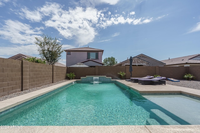 view of pool featuring pool water feature and a patio area