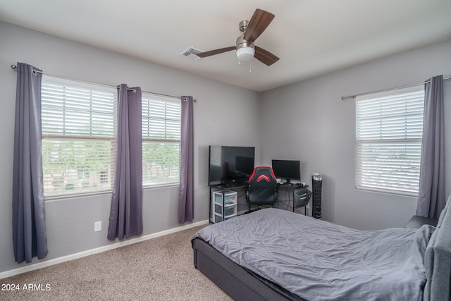 carpeted bedroom with ceiling fan