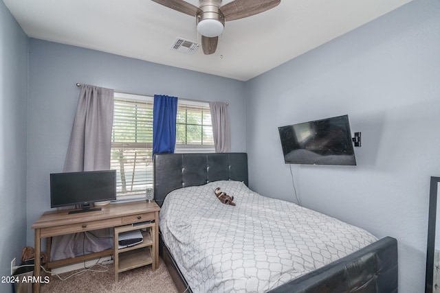 bedroom with dark colored carpet and ceiling fan