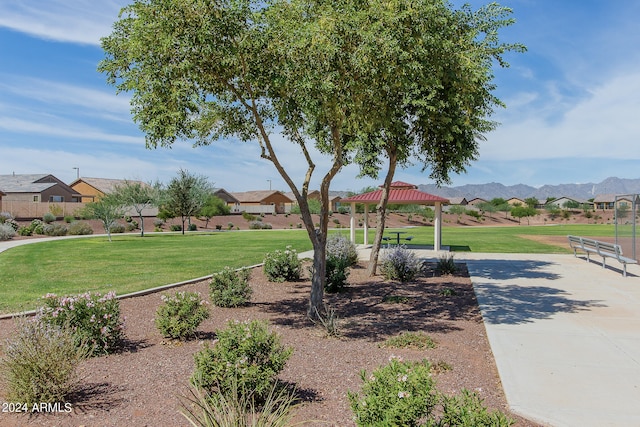 view of home's community featuring a gazebo, a lawn, and a mountain view