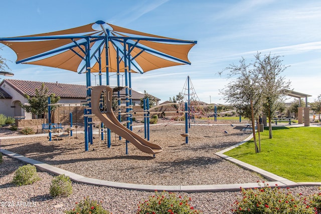 view of jungle gym featuring a lawn