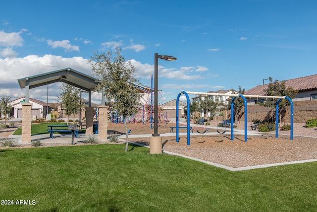 view of playground with a lawn