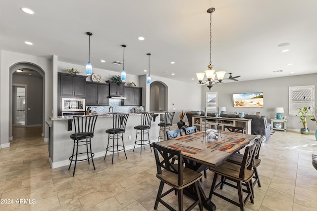 dining space featuring an inviting chandelier