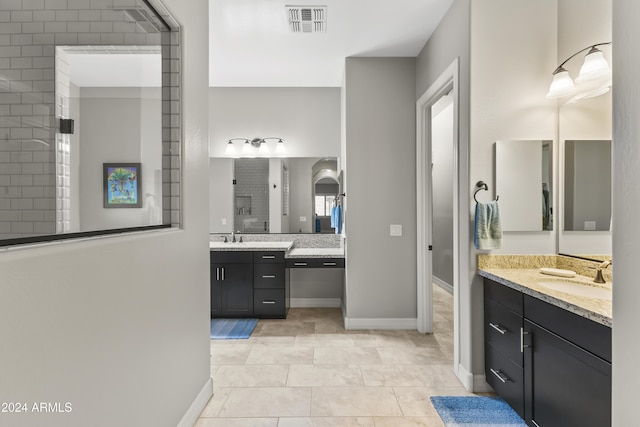 bathroom with tile patterned flooring and vanity