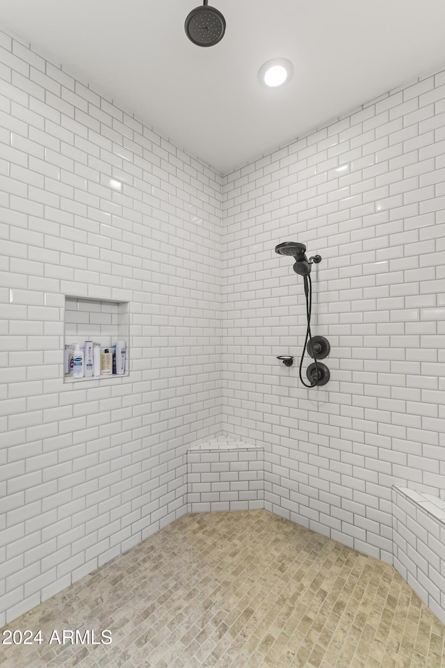 bathroom with tiled shower