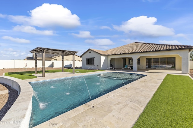 view of pool with pool water feature, a patio area, a pergola, and a yard