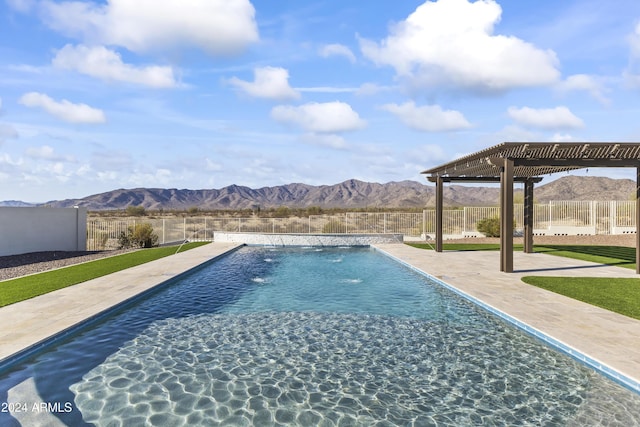 view of swimming pool featuring a pergola, a mountain view, and a patio