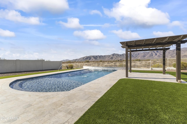 view of pool featuring a yard, a pergola, pool water feature, a mountain view, and a patio