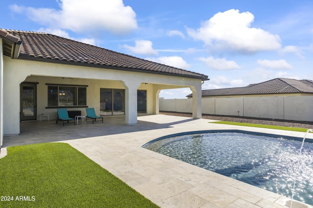 view of swimming pool with a patio area