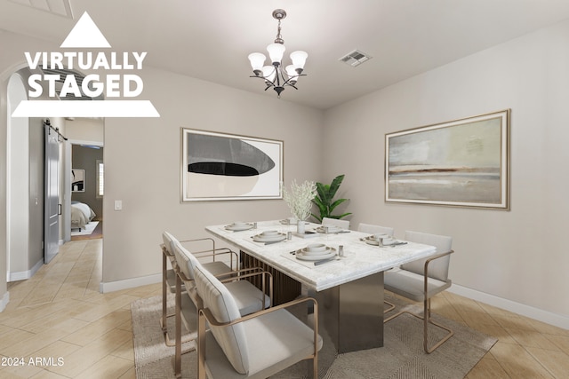 dining room with a notable chandelier