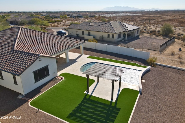 view of swimming pool featuring a mountain view and a patio area