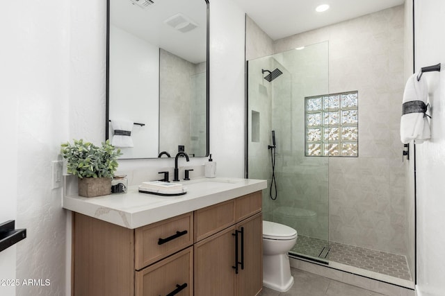 bathroom featuring toilet, a walk in shower, vanity, tile patterned flooring, and recessed lighting