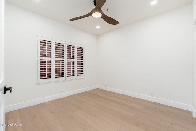 spare room with recessed lighting, ceiling fan, light wood-type flooring, and baseboards