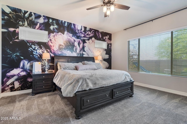 carpeted bedroom featuring baseboards and a ceiling fan