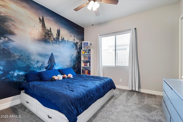 carpeted bedroom with baseboards and ceiling fan