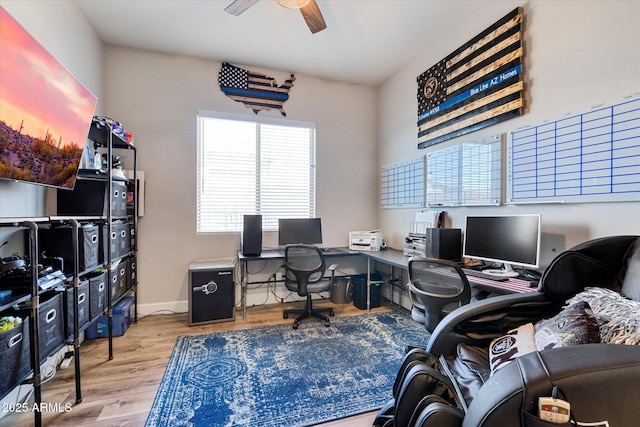 office featuring baseboards, a ceiling fan, and wood finished floors