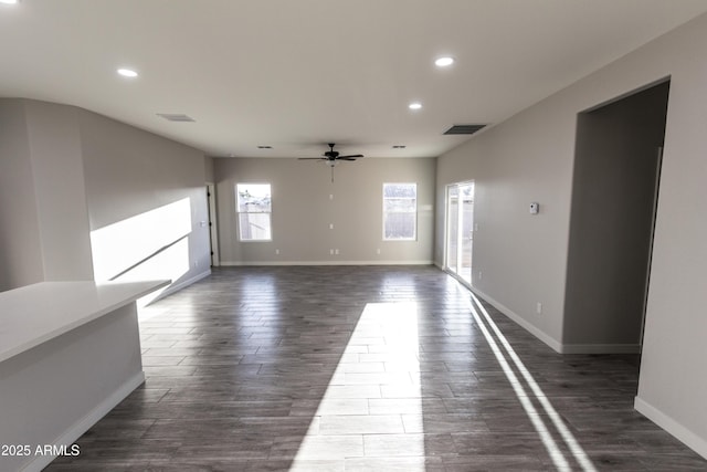 interior space with dark wood-style floors, recessed lighting, a ceiling fan, and visible vents