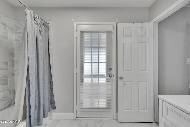 bathroom featuring vanity and shower / bath combination with curtain