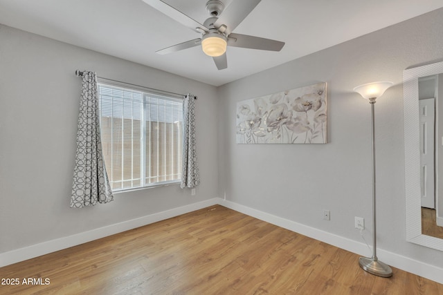 spare room featuring light hardwood / wood-style floors and ceiling fan