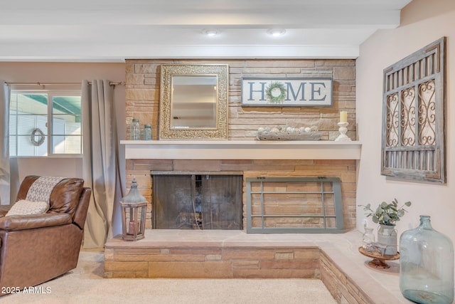 room details with a large fireplace and beam ceiling