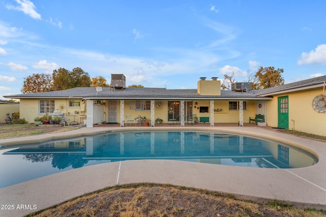 pool with cooling unit and a patio