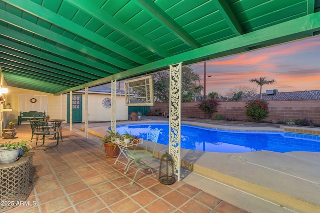 view of swimming pool featuring a fenced in pool, a patio area, and a fenced backyard