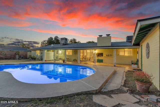 view of swimming pool featuring a patio area and a fenced in pool